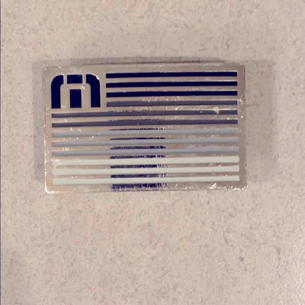 Travis Mathew belt buckles